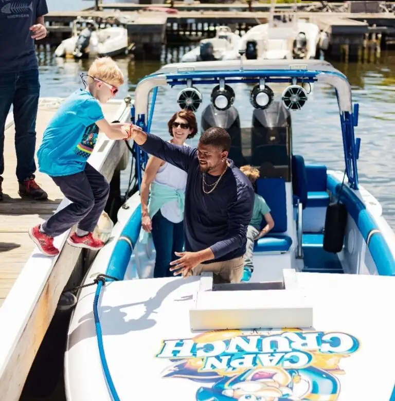 Image of boy boarding Wet and Wild Boat Charter