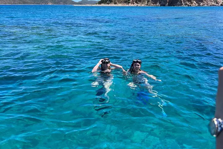 image of two girls snorkling with wet and wild boat charters